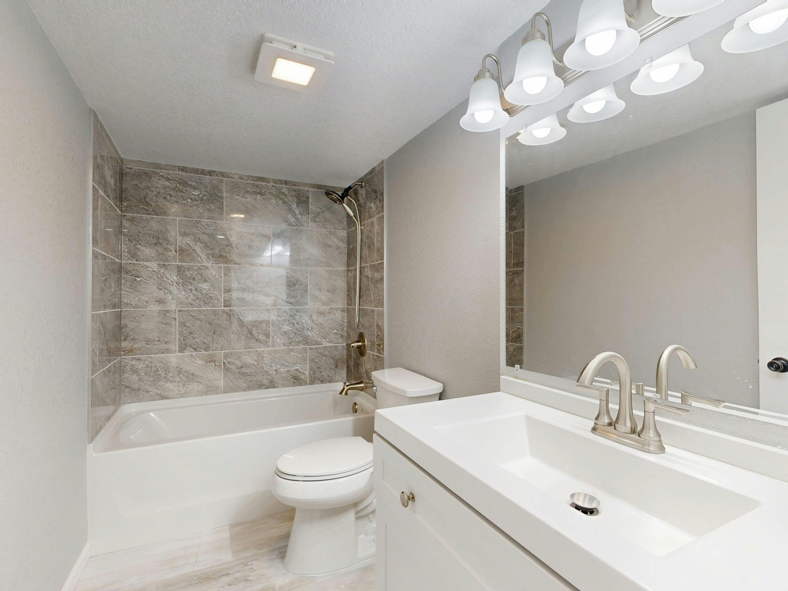 Luxurious modern bedroom featuring elegant design elements, soft lighting, and cozy bedding.